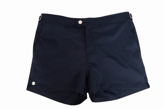 Navy blue swim shorts with a mid-thigh inseam, button closure, and side tabs.