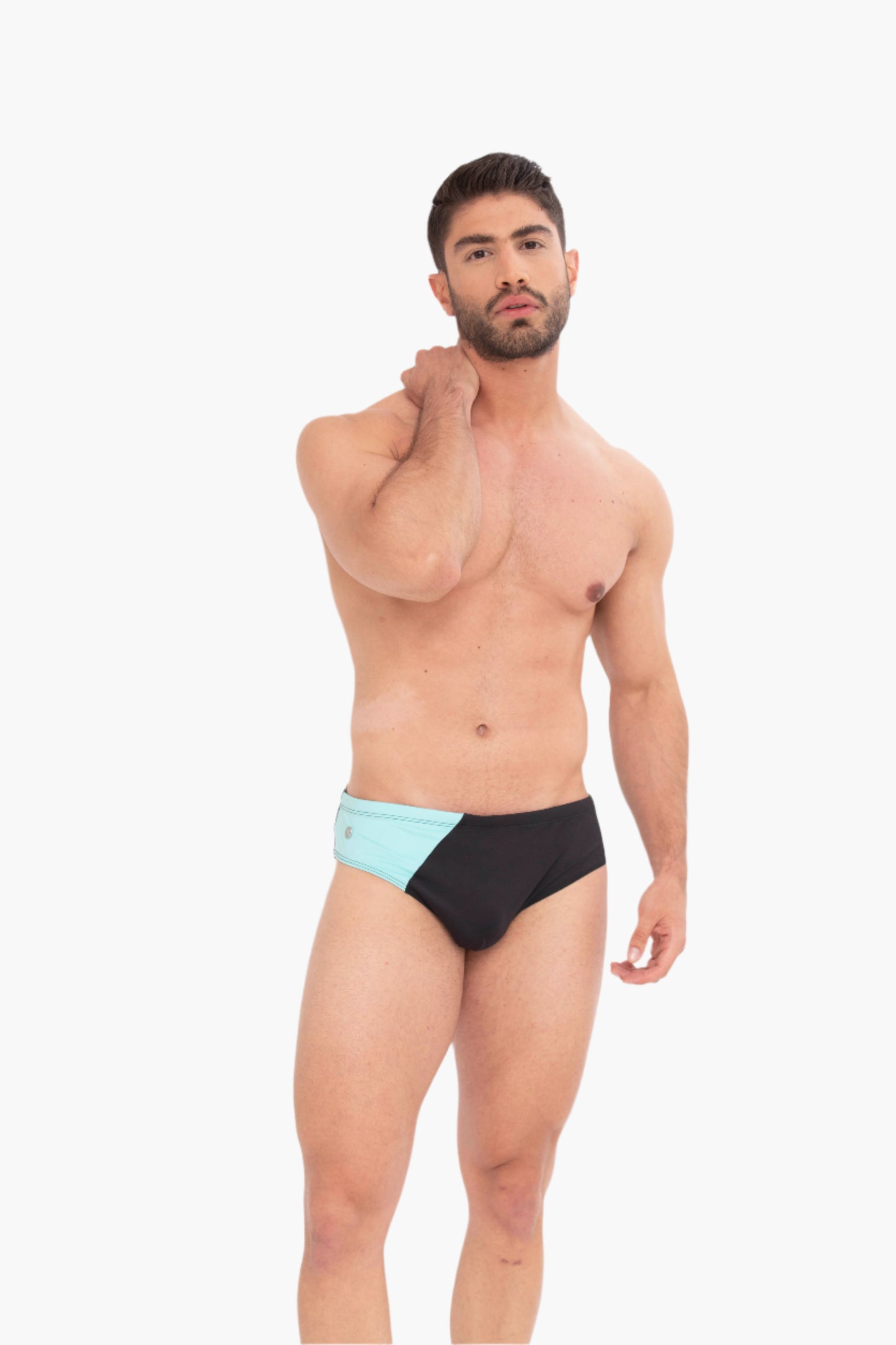 Man wearing black and light blue swim briefs on a white background. inspired by diamond beach in iceland.