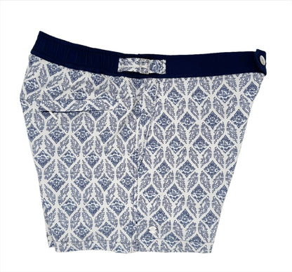side view of swim shorts in aegean mosaic pattern. Blue and white