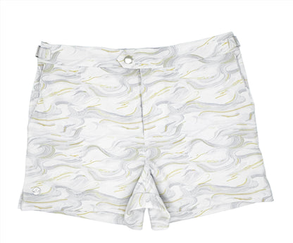 A pair of white swim shorts with a Carrara marble print design, featuring a mid-thigh length and a button fly closure.